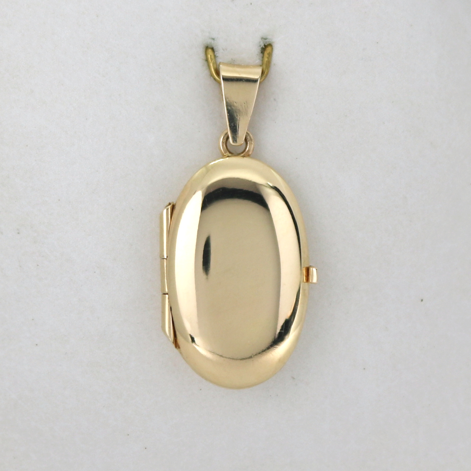 Kultainen medaljonki 20 mm.